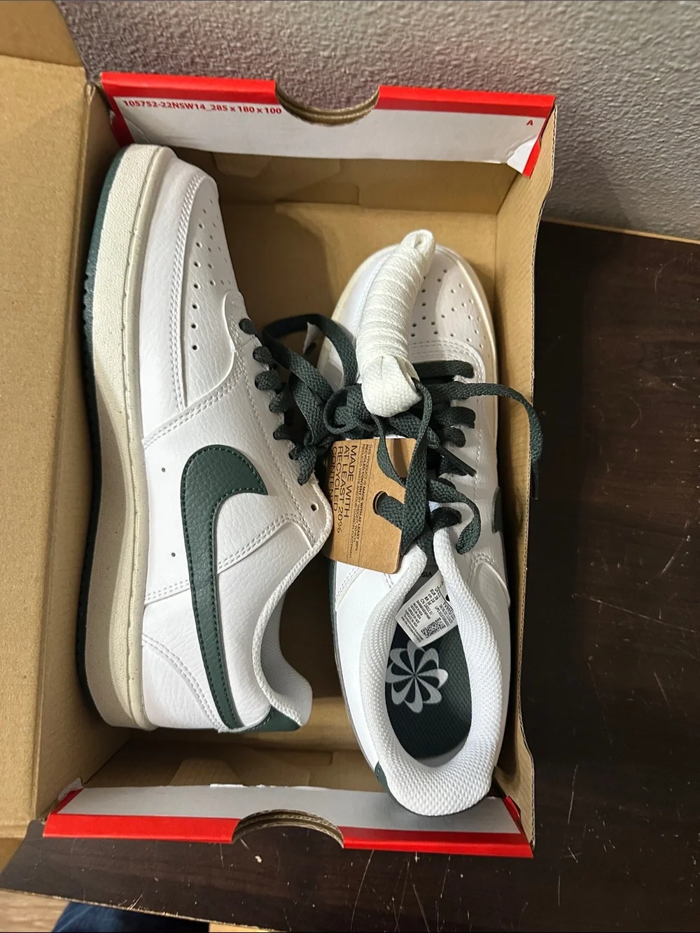 Nike White Low-Top Sneakers with Dark Green Swoosh and Heel